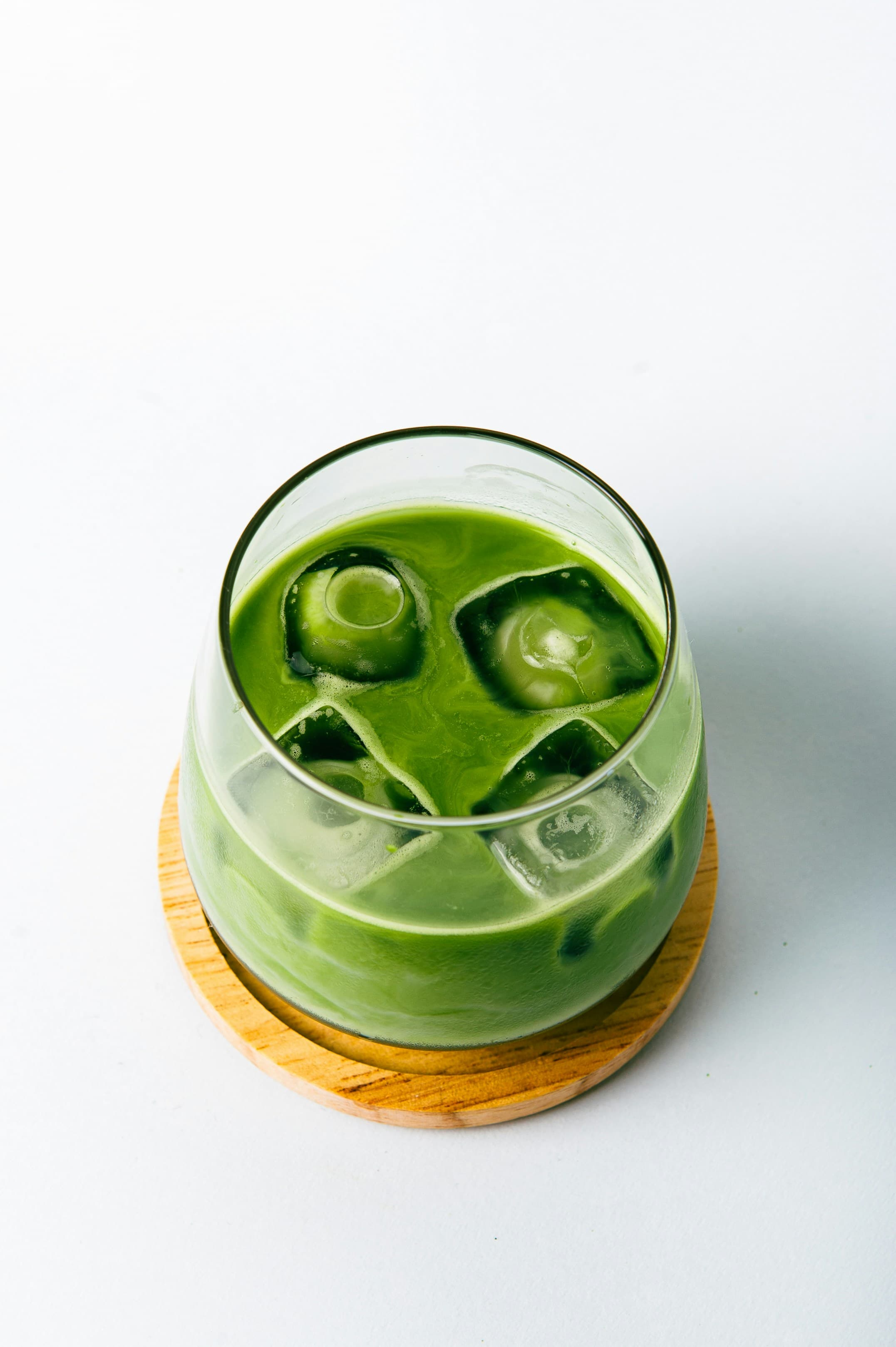 Refreshing iced matcha drink with ice cubes